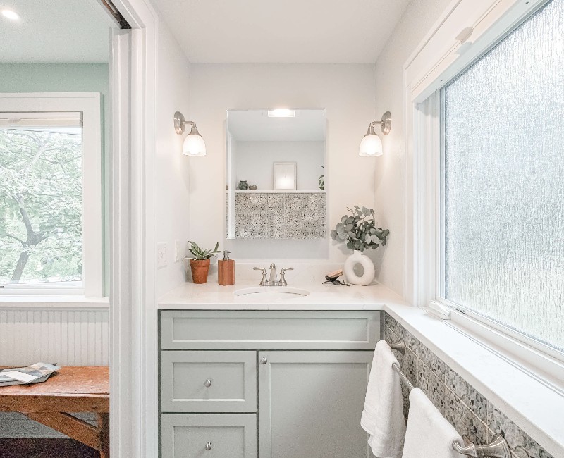 What began as a cold, drafty enclosed porch is now one of the homeowners’ favorite rooms. A bright, energy-efficient sunroom with a beautifully integrated first-floor bathroom. 