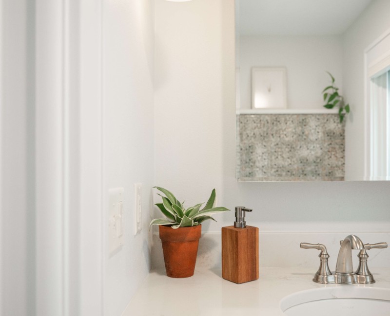 What began as a cold, drafty enclosed porch is now one of the homeowners’ favorite rooms. A bright, energy-efficient sunroom with a beautifully integrated first-floor bathroom. 