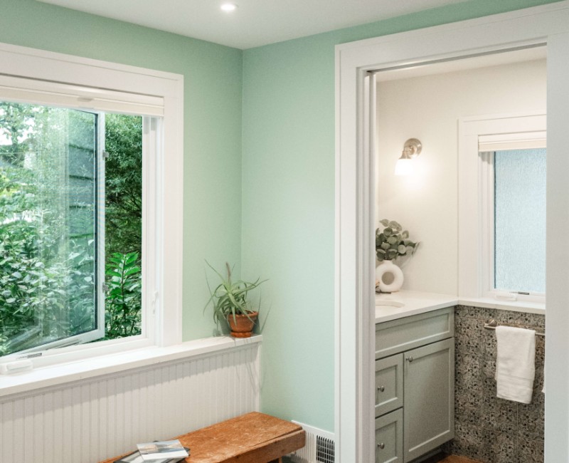 What began as a cold, drafty enclosed porch is now one of the homeowners’ favorite rooms. A bright, energy-efficient sunroom with a beautifully integrated first-floor bathroom. 