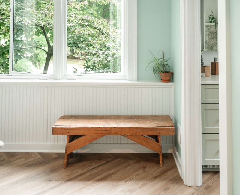 What began as a cold, drafty enclosed porch is now one of the homeowners’ favorite rooms. A bright, energy-efficient sunroom with a beautifully integrated first-floor bathroom. 