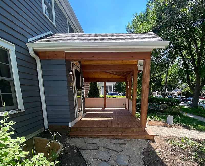 This front porch addition in Madison, WI, created an inviting protected entryway that also provided the homeowners with additional seating space.