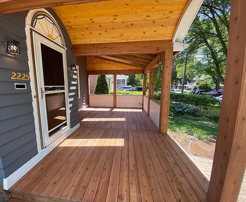This front porch addition in Madison, WI, created an inviting protected entryway that also provided the homeowners with additional seating space.