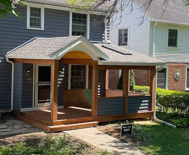 This front porch addition in Madison, WI, created an inviting protected entryway that also provided the homeowners with additional seating space.