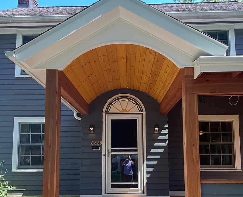 This front porch addition in Madison, WI, created an inviting protected entryway that also provided the homeowners with additional seating space.