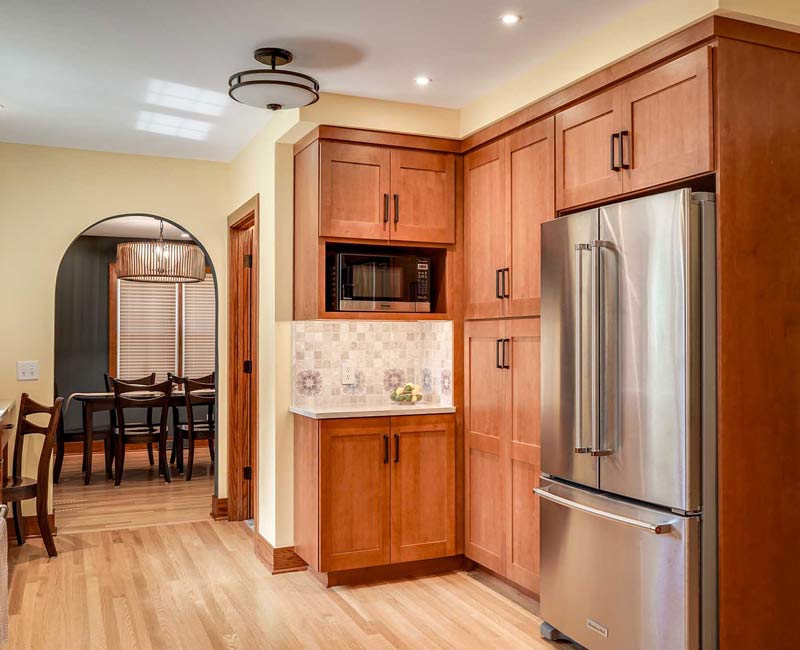 This whole-house remodel in Madison, WI, provided the homeowners with an updated kitchen, dining room, living room, library, entryway, and powder room.