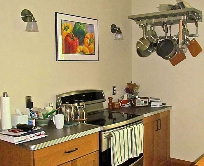 For this 100-year-old farmhouse in Mt. Horeb, WI, we remodeled the primary bathroom, kitchen, mudroom, and entryway. We also updated the pantry to include a built-in sliding ladder and restored the front porch.
