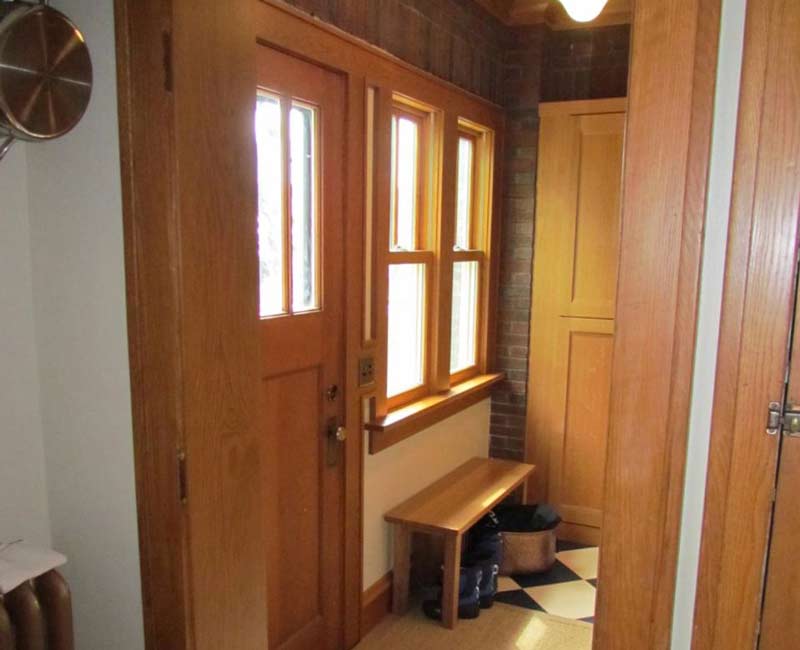For this 100-year-old farmhouse in Mt. Horeb, WI, we remodeled the primary bathroom, kitchen, mudroom, and entryway. We also updated the pantry to include a built-in sliding ladder and restored the front porch.