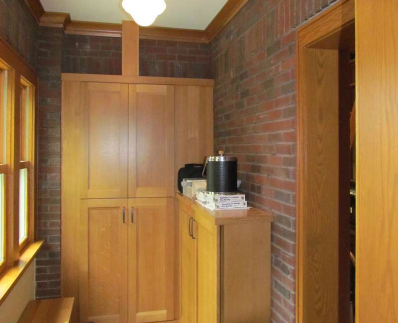 For this 100-year-old farmhouse in Mt. Horeb, WI, we remodeled the primary bathroom, kitchen, mudroom, and entryway. We also updated the pantry to include a built-in sliding ladder and restored the front porch.