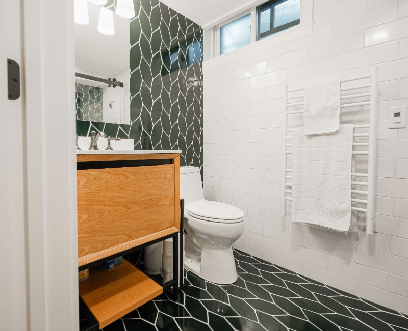 These two bathroom remodels are part of a larger whole-home renovation in Madison's Nakoma neighborhood, using unique tile in both spaces that brought our client's creative vision to life.
