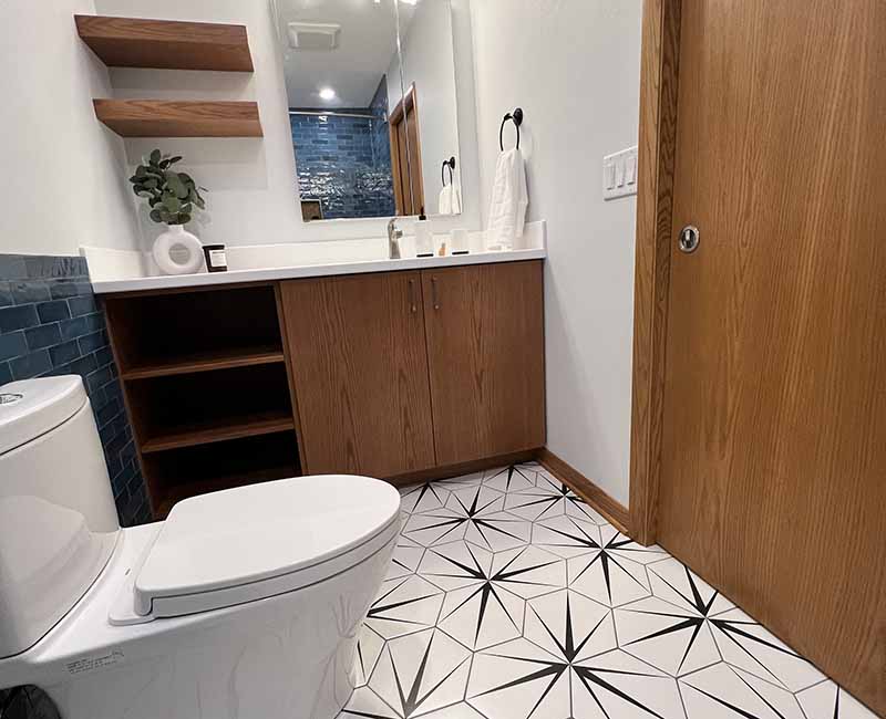 We kept the mid-century modern vibe alive in this two-bathroom remodel in Madison, WI.