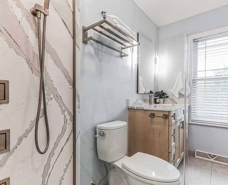 We completed a full remodel of both the primary bathroom and guest bathroom in this home in Madison, WI. Cambria quartz was used on all shower and bath walls and the tops of the bathroom vanities.