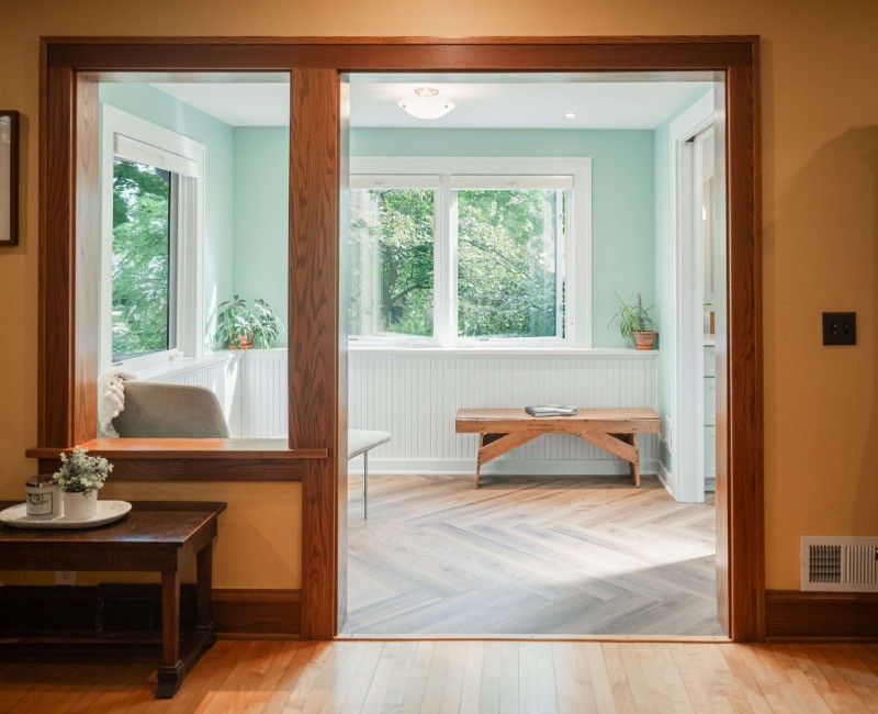 What began as a cold, drafty enclosed porch is now one of the homeowners’ favorite rooms. A bright, energy-efficient sunroom with a beautifully integrated first-floor bathroom. 