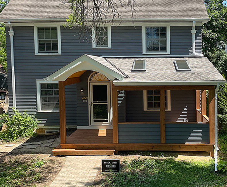 This front porch addition in Madison, WI, created an inviting protected entryway that also provided the homeowners with additional seating space.