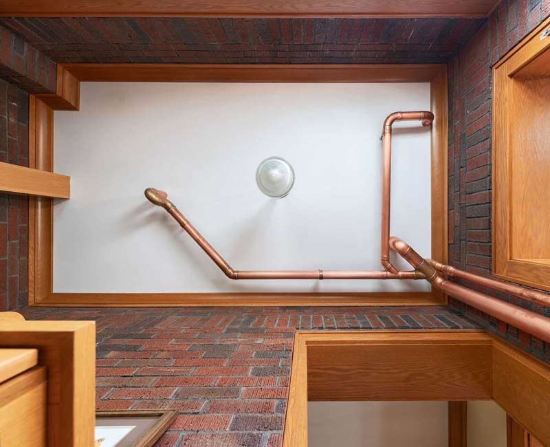 For this 100-year-old farmhouse in Mt. Horeb, WI, we remodeled the primary bathroom, kitchen, mudroom, and entryway. We also updated the pantry to include a built-in sliding ladder and restored the front porch.